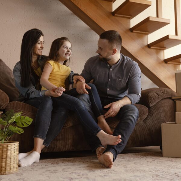 full-shot-parents-kid-couch-scaled