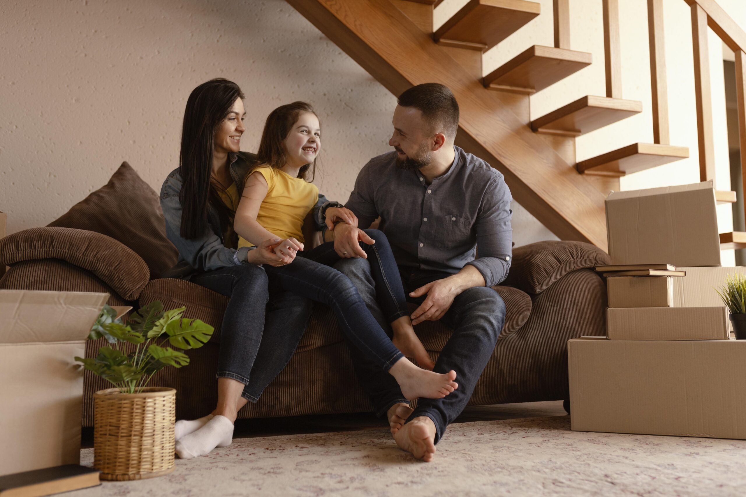 full-shot-parents-kid-couch-scaled